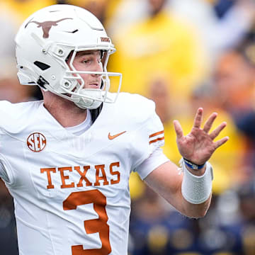 Texas quarterback Quinn Ewers (3) makes a pass against Michigan during the first half at Michigan Stadium in Ann Arbor on Saturday, September 7, 2024.