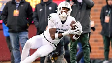 Oct 28, 2023; Minneapolis, Minnesota, USA;  Michigan State Spartans wide receiver Jaron Glover (15) catches a pass against the Minnesota Golden Gophers during the fourth quarter at Huntington Bank Stadium. Mandatory Credit: Nick Wosika-Imagn Images