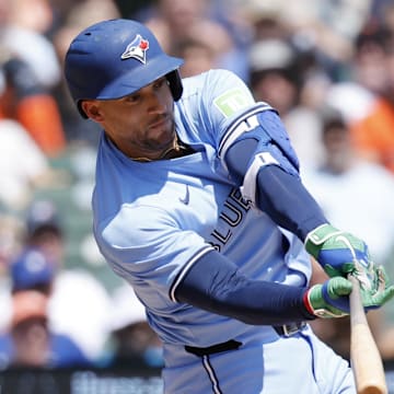 Jul 27, 2025; Detroit, Michigan, USA;  Toronto Blue Jays outfielder George Springer (4) hits a single in the third inning against the Detroit Tigers at Comerica Park. 