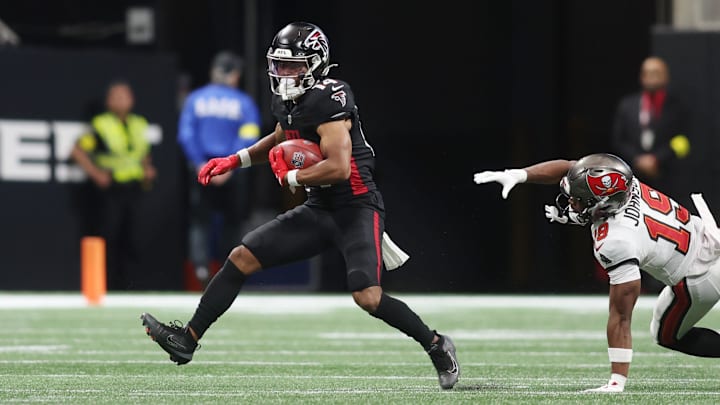 Sep 7, 2025; Atlanta, Georgia, USA; Atlanta Falcons wide receiver Jamal Agnew (14) runs with the ball against the Tampa Bay Buccaneers during the first quarter at Mercedes-Benz Stadium. Mandatory Credit: Brett Davis-Imagn Images