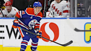 Oct 22, 2024; Edmonton, Alberta, CAN; Edmonton Oilers defensemen Travis Dermott (24) follows the play against the Carolina Hurricanes at Rogers Place. Mandatory Credit: Perry Nelson-Imagn Images