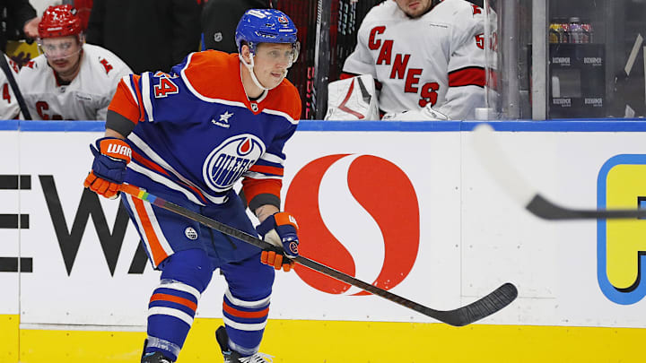 Oct 22, 2024; Edmonton, Alberta, CAN; Edmonton Oilers defensemen Travis Dermott (24) follows the play against the Carolina Hurricanes at Rogers Place. Mandatory Credit: Perry Nelson-Imagn Images