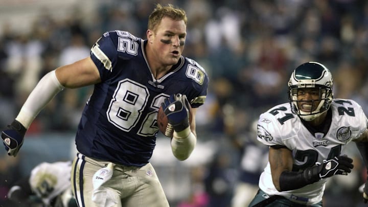 Dallas Cowboys tight end Jason Witten picks up yardage after losing his helmet during game against Philadelphia Eagles at Lincoln Financial Field in Philadelphia.