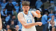 Dec 7, 2025; Chapel Hill, North Carolina, USA; North Carolina Tar Heels guard Luka Bogavac (44) and center Henri Veesaar (13) and forward Caleb Wilson (8) and Georgetown Hoyas center Julius Halaifonua (11) react at the end of the game at Dean E. Smith Center. Mandatory Credit: Bob Donnan-Imagn Images