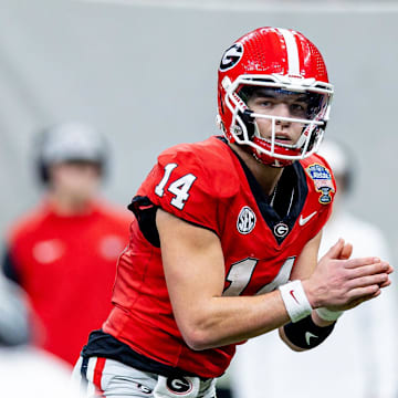 Jan 2, 2025; New Orleans, LA, USA;  Georgia Bulldogs quarterback Gunner Stockton (14) looks on against the Notre Dame Fighting Irish during the second half at Caesars Superdome. Mandatory Credit: Stephen Lew-Imagn Images