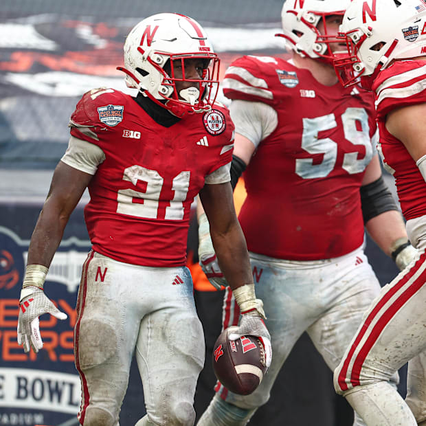 Nebraska Cornhuskers running back Emmett Johnson (21) celebrates with teammates after a touchdown.