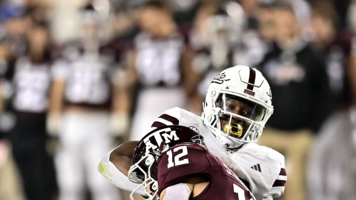 Nov 11, 2023; College Station, Texas, USA; Mississippi State Bulldogs running back Seth Davis (23) is tackled by Texas A&M Aggies linebacker Sam Mathews (12) during the fourth quarter at Kyle Field. Mandatory Credit: Maria Lysaker-USA TODAY Sports