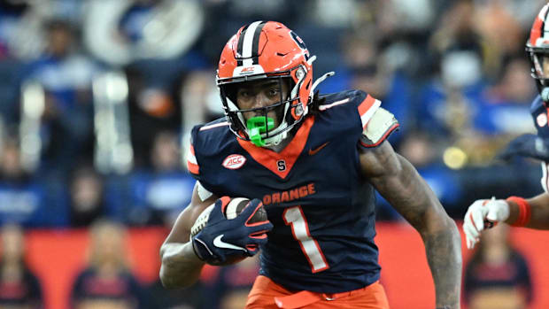 Syracuse Orange running back LeQuint Allen carries the ball in the first quarter against the Connecticut Huskies. 