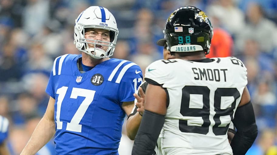 Indianapolis Colts quarterback Philip Rivers (17) and Jacksonville Jaguars defensive end Dawuane Smoot (98) exchange words.