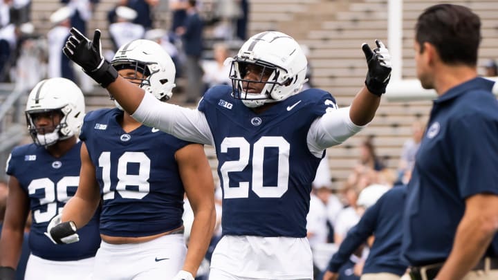 Penn State defensive end Adisa Isaac (20) enters the field with the rest of the defensive unit for team warmups before an NCAA football game against Indiana Saturday, Oct. 28, 2023, in State College, Pa. The Nittany Lions won, 33-24.