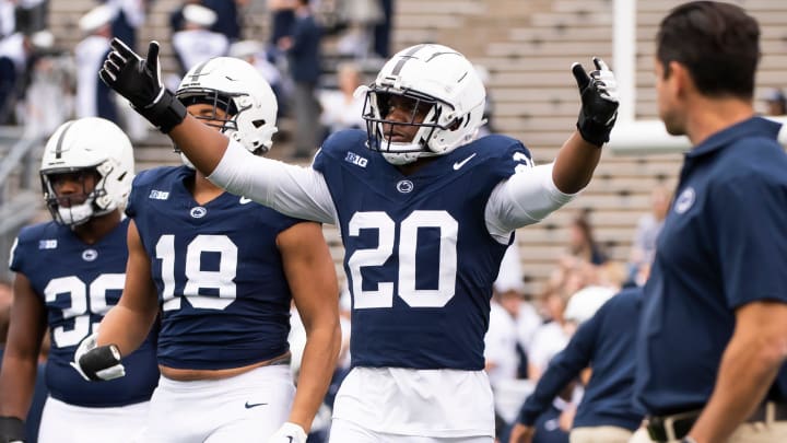 Penn State defensive end Adisa Isaac (20) enters the field with the rest of the defensive unit for team warmups before an NCAA football game against Indiana Saturday, Oct. 28, 2023, in State College, Pa. The Nittany Lions won, 33-24.