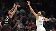 Jun 29, 2022; Phoenix, Arizona, USA; Indiana Fever guard Victoria Vivians (35) shoots over Phoenix Mercury forward Brianna Turner (21) during the first half at Footprint Center. Mandatory Credit: Joe Camporeale-Imagn Images
