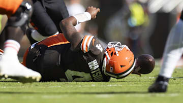 Oct 20, 2024; Cleveland, Ohio, USA; Cleveland Browns quarterback Deshaun Watson (4) falls to the ground with a torn Achilles during the second quarter against the Cincinnati Bengals at Huntington Bank Field. Mandatory Credit: Scott Galvin-Imagn Images