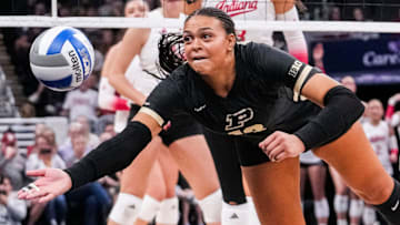 Purdue Boilermakers outside hitter Akasha Anderson (13) dives for a ball 