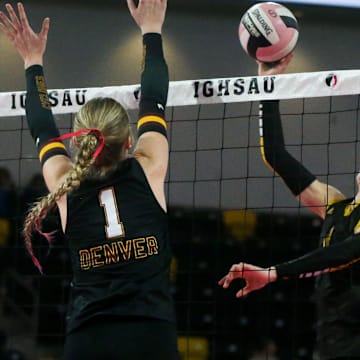 Eddyville-Blakesburg-Fremont's Molly Shafer (1) attacks as Denver’s Grace Mullihan (17) and Channing Johnson (1) defend in the Class 2A state volleyball championship Thursday, Nov. 7, 2024 at Xtream Arena in Coralville, Iowa.