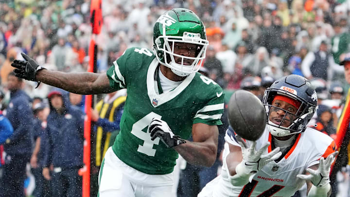 Sep 29, 2024; East Rutherford, New Jersey, USA; Denver Broncos wide receiver Courtland Sutton (14) can not hang on to a pass as New York Jets cornerback D.J. Reed (4) defends during the first quarter at MetLife Stadium.
