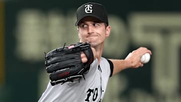 Mar 16, 2025; Bunkyo, Tokyo, Japan; Yomiuri Giants starting pitcher Foster Griffin (29) throws a pitch against the Yomiuri Giants during the first inning at Tokyo Dome. Mandatory Credit: Darren Yamashita-Imagn Images