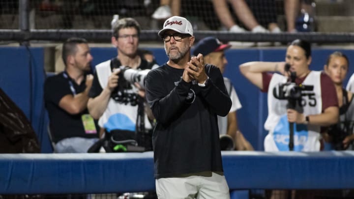 May 31, 2024; Oklahoma City, OK, USA;  Oklahoma St. Cowgirls head coach Kenny Gajewski claps in the second inning against the Stanford Cardinals during a Women's College World Series softball losers bracket elimination game at Devon Park. Mandatory Credit: Brett Rojo-USA TODAY Sports