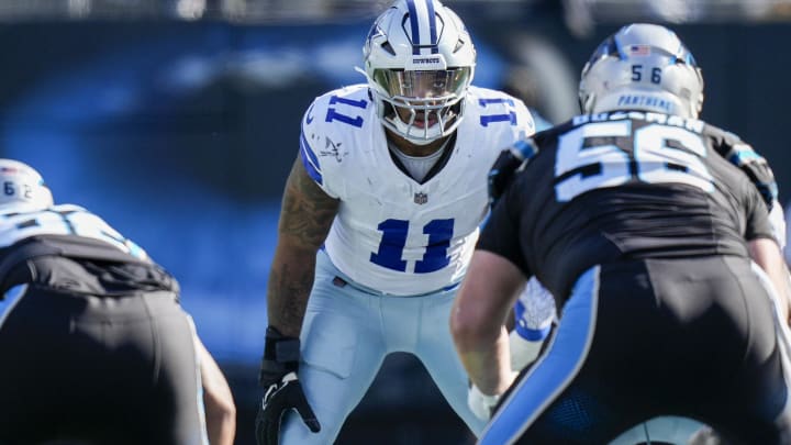 Nov 19, 2023; Charlotte, North Carolina, USA; Dallas Cowboys linebacker Micah Parsons (11) eyes the offense during the second quarter against the Carolina Panthers at Bank of America Stadium. 