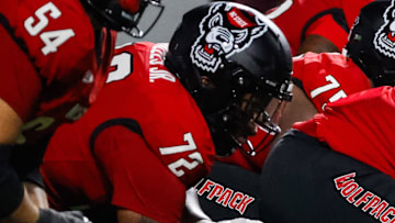 Sep 27, 2025; Raleigh, North Carolina, USA;  North Carolina State Wolfpack offensive lineman Jalen Grant (74) with the ball during the first half of the game against Virginia Tech Hokies at Carter-Finley Stadium. Mandatory Credit: Jaylynn Nash-Imagn Images