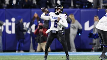 Nov 16, 2024; Provo, Utah, USA; Kansas Jayhawks quarterback Jalon Daniels (6) passes the ball against the Kansas Jayhawks during the fourth quarter at LaVell Edwards Stadium. Mandatory Credit: Rob Gray-Imagn Images