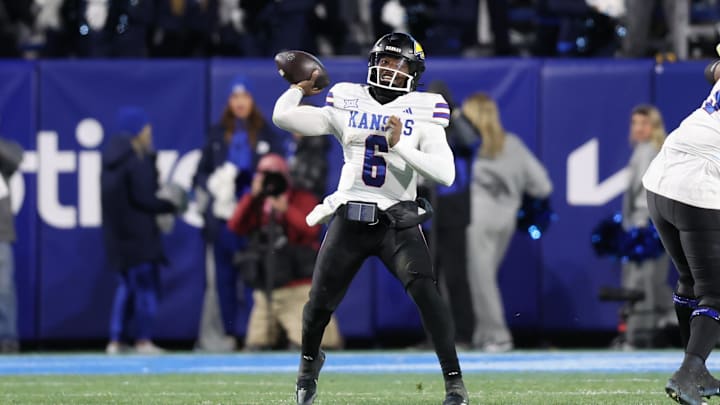 Nov 16, 2024; Provo, Utah, USA; Kansas Jayhawks quarterback Jalon Daniels (6) passes the ball against the Kansas Jayhawks during the fourth quarter at LaVell Edwards Stadium. Mandatory Credit: Rob Gray-Imagn Images