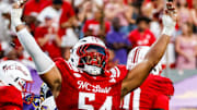 Aug 28, 2025; Raleigh, North Carolina, USA; North Carolina State Wolfpack defensive end Sabastian Harsh (54) celebrates a sack during the first half of the game against East Carolina Pirates at Carter-Finley Stadium. Mandatory Credit: Jaylynn Nash-Imagn Images