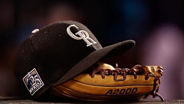 May 10, 2018; Denver, CO, USA; A detail view of a Colorado Rockies players hat and glove in the fifth inning against the Milwaukee Brewers at Coors Field. Mandatory Credit: Isaiah J. Downing-Imagn Images
