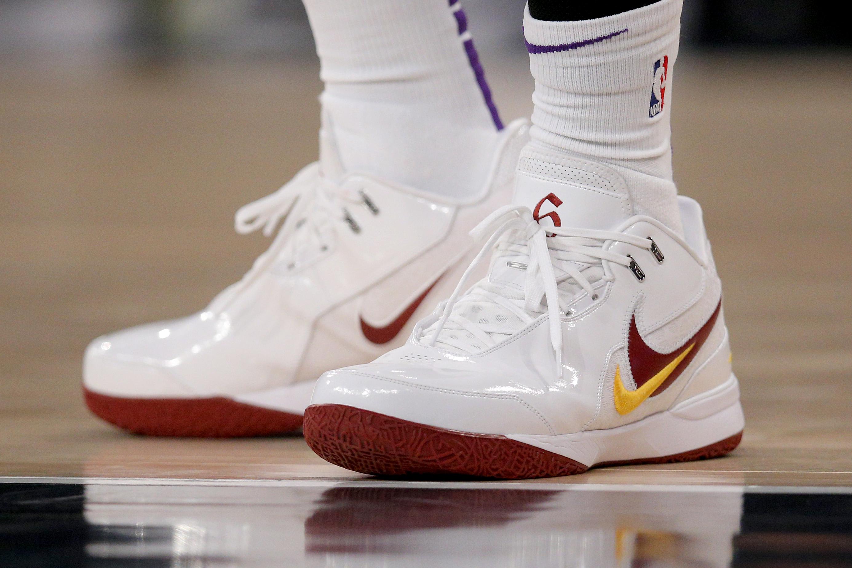 Los Angeles Lakers forward LeBron James' white and gold sneakers.