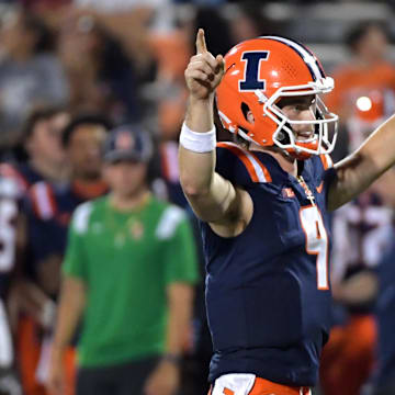 Aug 29, 2024; Champaign, Illinois, USA;  Illinois Fighting Illini quarterback Luke Altmyer (9) reacts after a touchdown during the second half against the Eastern Illinois Panthers at Memorial Stadium. Mandatory Credit: Ron Johnson-USA TODAY Sports