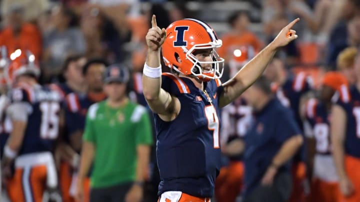 Aug 29, 2024; Champaign, Illinois, USA;  Illinois Fighting Illini quarterback Luke Altmyer (9) reacts after a touchdown during the second half against the Eastern Illinois Panthers at Memorial Stadium. Mandatory Credit: Ron Johnson-USA TODAY Sports