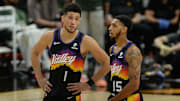 Jul 8, 2021; Phoenix, Arizona, USA; Phoenix Suns guard Devin Booker (1) speaks with guard Cameron Payne (15) during the second half in game two of the 2021 NBA Finals at Phoenix Suns Arena. Mandatory Credit: Joe Camporeale-Imagn Images