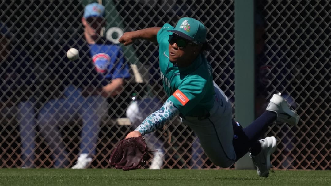 Mar 12, 2026; Mesa, Arizona, USA; Seattle Mariners shortstop Michael Arroyo (96) dives for the ball against the Chicago Cubs in the third inning at Sloan Park. Mandatory Credit: Rick Scuteri-Imagn Images