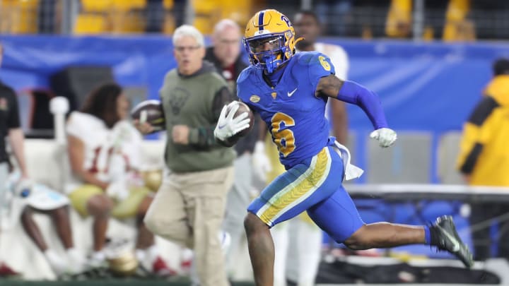 Nov 16, 2023; Pittsburgh, Pennsylvania, USA;  Pittsburgh Panthers running back Rodney Hammond Jr. (6) scores on a sixty-five yard touchdown run against the Boston College Eagles during the fourth quarter at Acrisure Stadium. Mandatory Credit: Charles LeClaire-USA TODAY Sports