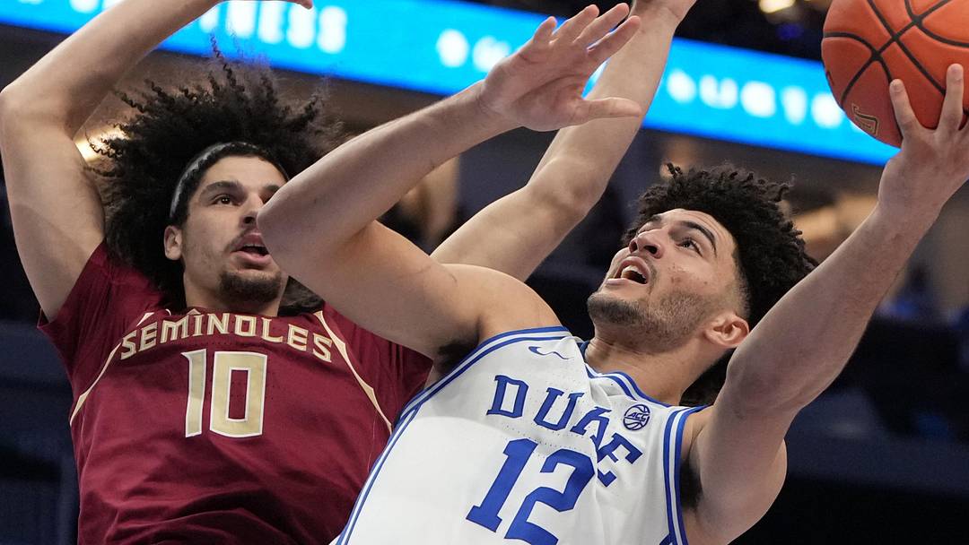 Mar 12, 2026; Charlotte, NC, USA; Duke Blue Devils forward Cameron Boozer (12) shoots as Florida State Seminoles guard Lajae Jones (10) defends in the second half at Spectrum Center. Mandatory Credit: Bob Donnan-Imagn Images Mar 12, 2026; Charlotte, NC, USA; Duke Blue Devils forward Cameron Boozer (12) shoots as Florida State Seminoles guard Lajae Jones (10) defends in the second half at Spectrum Center. Mandatory Credit: Bob Donnan-Imagn Images