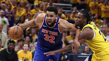 New York Knicks center Karl-Anthony Towns drives to the basket against Indiana Pacers guard Andrew Nembhard. Mandatory Credit: Trevor Ruszkowski-Imagn Images