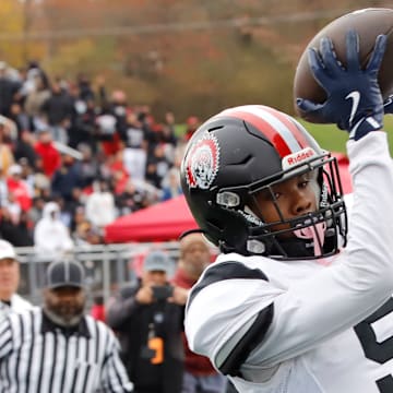 Aliquippa wide receiver Josh Lay catches a touchdown pass from Marques Council during the first half of the Quips' 21-12 win over McKeesport in the WPIAL Class 4A title game Saturday at Pine-Richland High School.