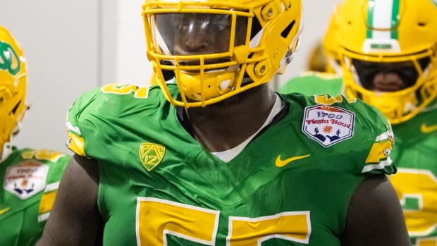 Jan 1, 2024; Glendale, AZ, USA; Oregon Ducks offensive lineman Marcus Harper II (55) against the Liberty Flames during the 20