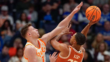 Tennessee forward Igor Milicic Jr. (7) blocks a shot by Texas forward Jayson Kent (25) during the first half of a Southeastern Conference tournament quarterfinal game.