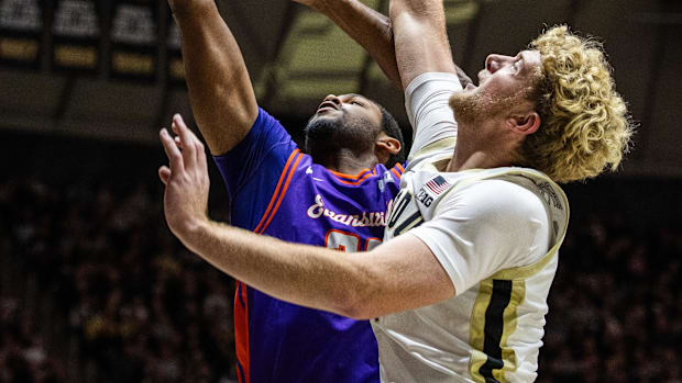 Evansville Purple Aces forward AJ Casey (23) shoots the ball 