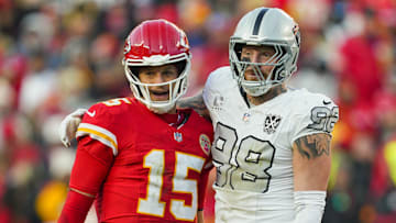 Nov 29, 2024; Kansas City, Missouri, USA; Kansas City Chiefs quarterback Patrick Mahomes (15) and Las Vegas Raiders defensive end Maxx Crosby (98) embrace during the second half at GEHA Field at Arrowhead Stadium. Mandatory Credit: Jay Biggerstaff-Imagn Images