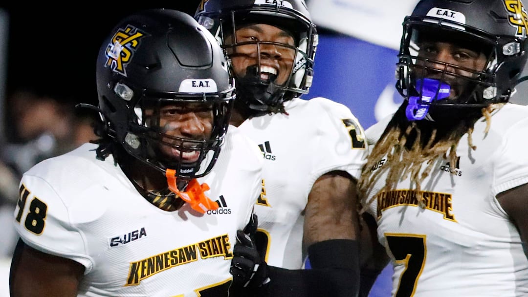 Kennesaw State linebacker Donelius Johnson (48) celebrates with his teammates Kennesaw State defensive back Milon Jones (29) and Kennesaw State linebacker Garland Benyard (7) after tackling Middle Tennessee running back Jekail Middlebrook (32) in the end zone for a touchback during the football game at MTSU, on Tuesday, Oct. 15, 2024.