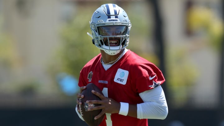 Jul 26, 2024; Oxnard, CA, USA; Dallas Cowboys quarterback Dak Prescott (4) drops to throw during training camp at the River Ridge Playing Fields in Oxnard, Californian.  Mandatory Credit: Jason Parkhurst-USA TODAY Sports