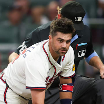 Sep 3, 2024; Atlanta, Georgia, USA; Atlanta Braves second baseman Whit Merrifield (15) on ground after being hit in the head with a pitch against the Colorado Rockies in the seventh inning at Truist Park