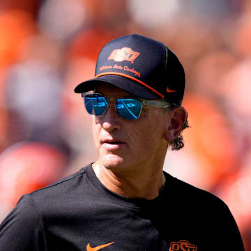 Oklahoma State Interim Head Coach/Offensive Coordinator Doug Meacham talks to players before the college football game between the Oklahoma State Cowboys and the Baylor Bears at Boone Pickens Stadium in Stillwater, Okla., Saturday, Sept. 27, 2025.