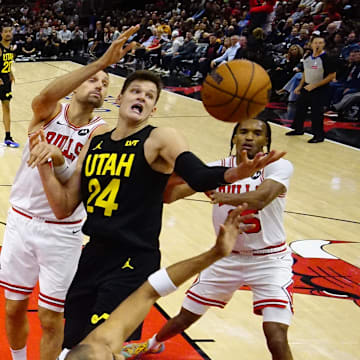 Nov 4, 2024; Chicago, Illinois, USA; Chicago Bulls forward Julian Phillips (15) defends Utah Jazz center Walker Kessler (24) during the second half at United Center. Mandatory Credit: David Banks-Imagn Images