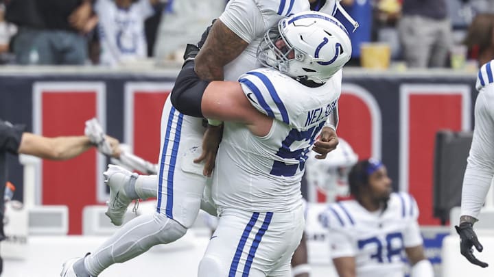 Oct 27, 2024; Houston, Texas, USA; Indianapolis Colts quarterback Anthony Richardson (5) celebrates with guard Quenton Nelson (56) after throwing a touchdown pass during the first quarter against the Houston Texans at NRG Stadium. Mandatory Credit: Troy Taormina-Imagn Images Oct 27, 2024; Houston, Texas, USA; Indianapolis Colts quarterback Anthony Richardson (5) celebrates with guard Quenton Nelson (56) after throwing a touchdown pass during the first quarter against the Houston Texans at NRG Stadium. Mandatory Credit: Troy Taormina-Imagn Images