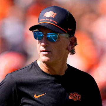 Oklahoma State Interim Head Coach/Offensive Coordinator Doug Meacham talks to players before the college football game between the Oklahoma State Cowboys and the Baylor Bears at Boone Pickens Stadium in Stillwater, Okla., Saturday, Sept. 27, 2025.