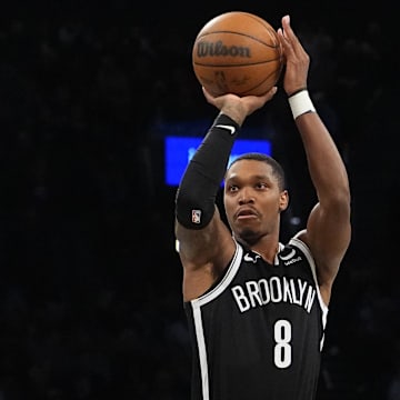 Feb 10, 2024; Brooklyn, New York, USA; Brooklyn Nets guard Lonnie Walker IV (8) shoots a three-point jump shot against the San Antonio Spurs during the second half at Barclays Center. Mandatory Credit: Gregory Fisher-USA TODAY Sports