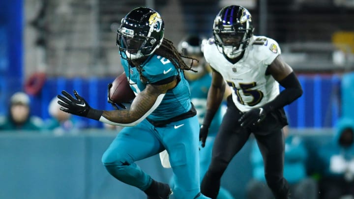 Jacksonville Jaguars safety Rayshawn Jenkins (2) runs back an intercepted early second-quarter pass intended for Baltimore Ravens wide receiver Nelson Agholor (15). The Jacksonville Jaguars hosted the Baltimore Ravens at EverBank Stadium in Jacksonville, Florida Sunday Night, December 17, 2023. The Jaguars trailed 10 to 0 at the half. 
